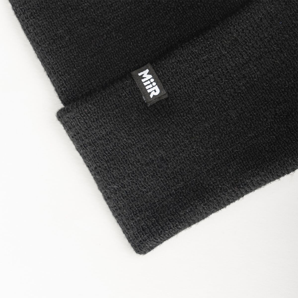 recycled-poly-fine-knit-beanie-i6 WebPDP-RecycledPolyFineKnitBeanie_Studio_TagDetail_Black__BNE005002OS.jpg